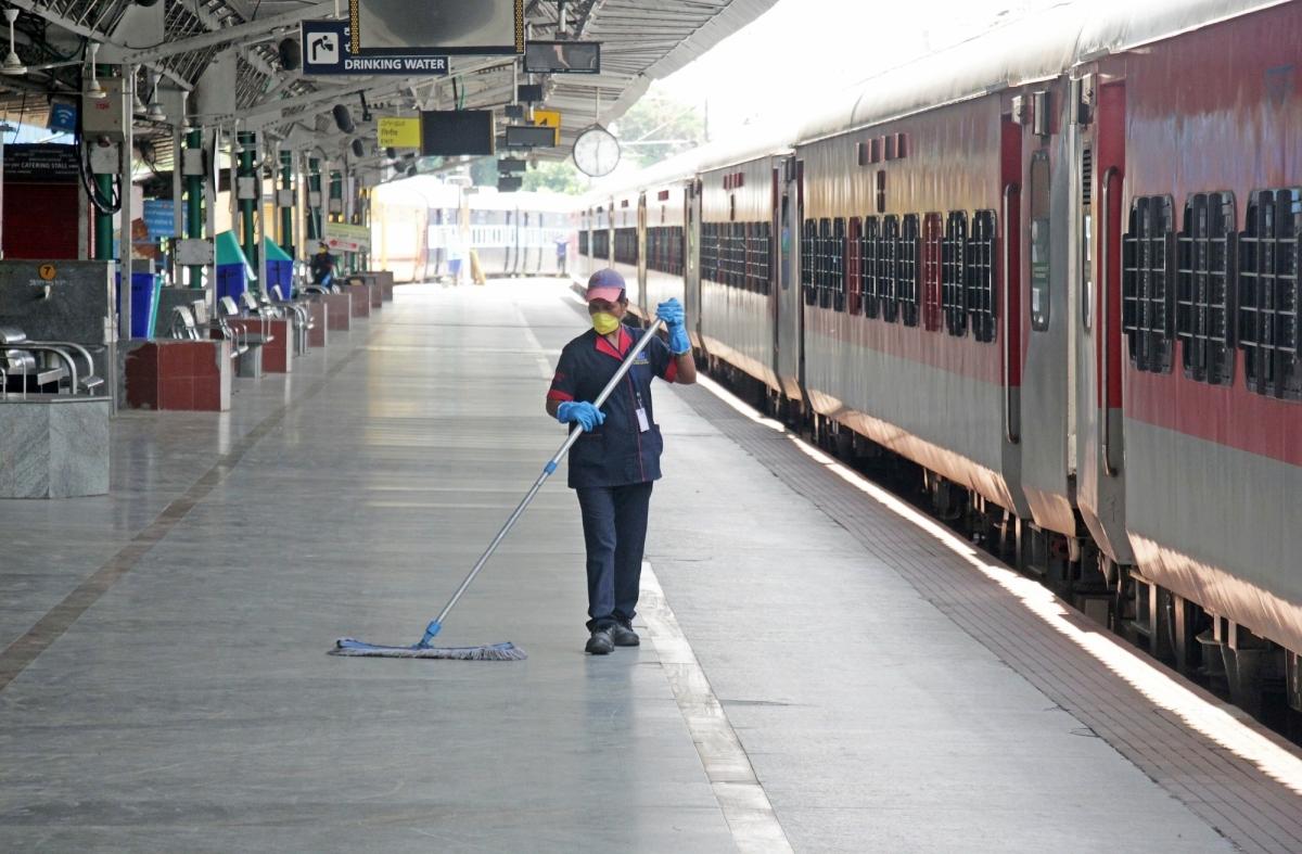 engaluru: Sanitation staff busy cleaning and disinfecting Bangalore City railway station during the extended nationwide lockdown imposed to mitigate the spread of coronavirus, on May 11, 2020.
