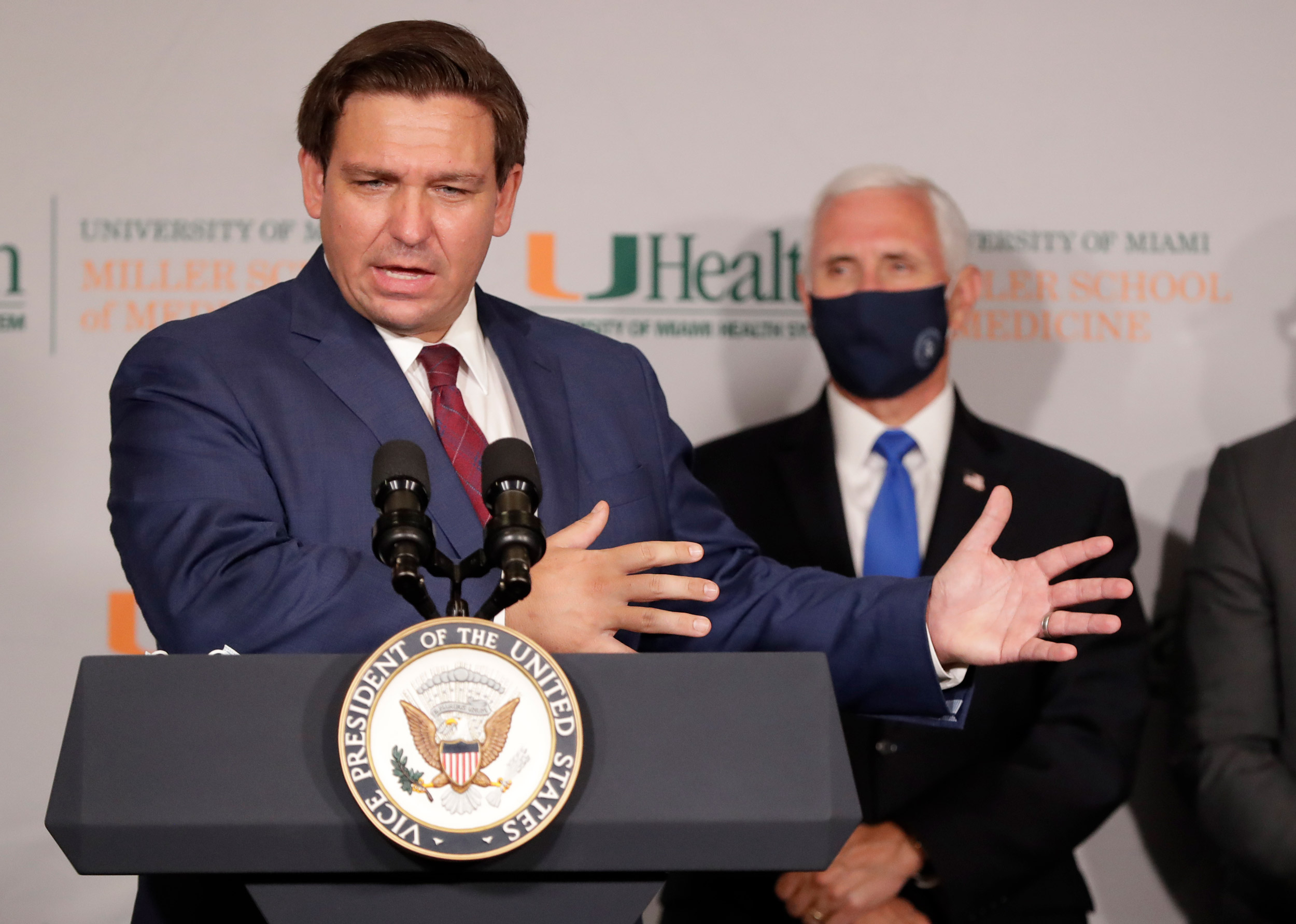 Florida Gov. Ron DeSantis, left, speaks during a news conference as Vice President Mike Pence at the University of Miami Miller School of Medicine Don Soffer Clinical Research Center on July 27 in Miami.